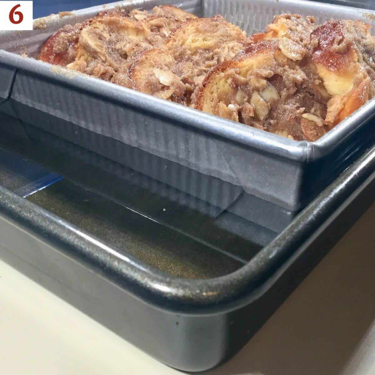 French toast in a baking pan inside a water bath.