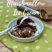 Chocolate Mint Marshmallow Ice Cream in a white bowl with spoon on a green towel Pinterest banner.