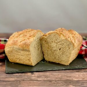 Sliced Multigrain Sourdough Sandwich Bread loaf on slate