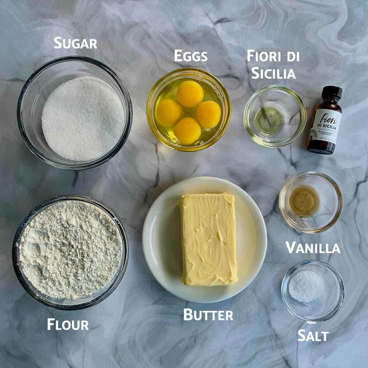 Orange Vanilla Pound Cake ingredients portioned into glass bowls.