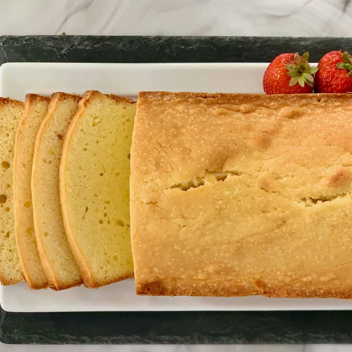 Orange Vanilla Pound Cake loaf sliced from overhead.