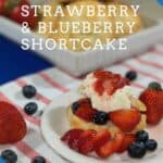 Strawberry Blueberry Shortcake plated on red striped towel Pinterest banner.