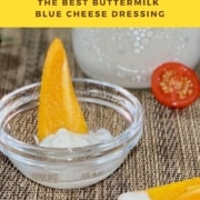 Closeup of yellow pepper dipped in buttermilk blue cheese dressing Pinterest banner..