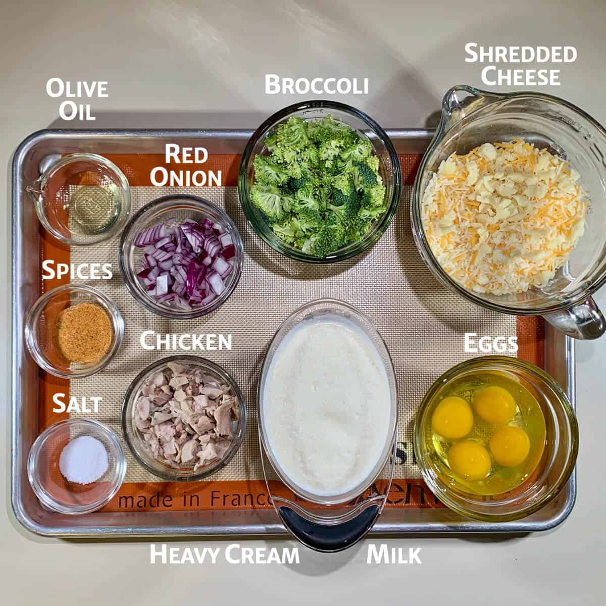 Chicken Broccoli Quiche ingredients on tray from overhead.