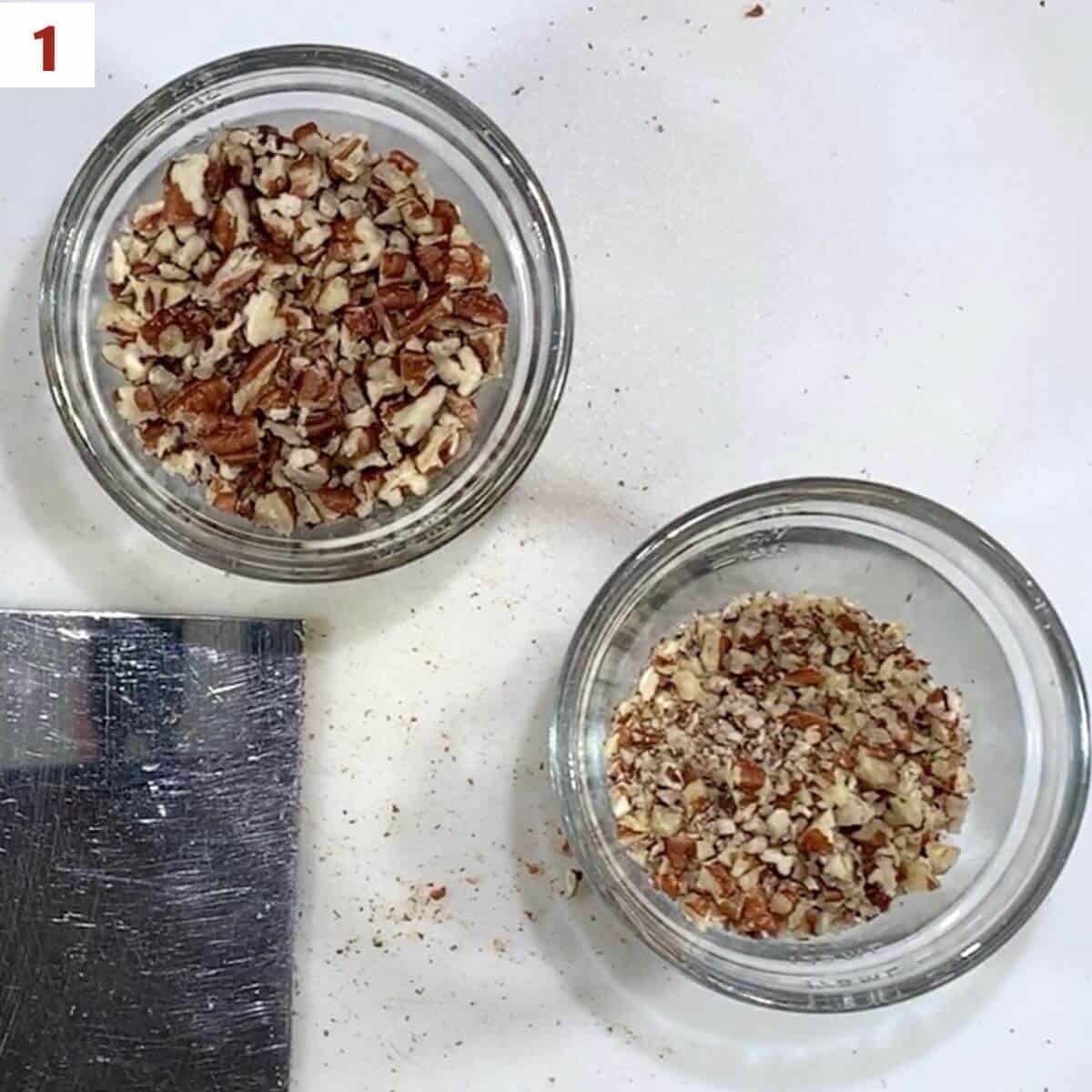 Coarsely and finely chopped pecans in separate glass bowls.