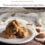 Pecan pralines stacked on a white plate with pecans & ivory scarf behind Pinterest banner.