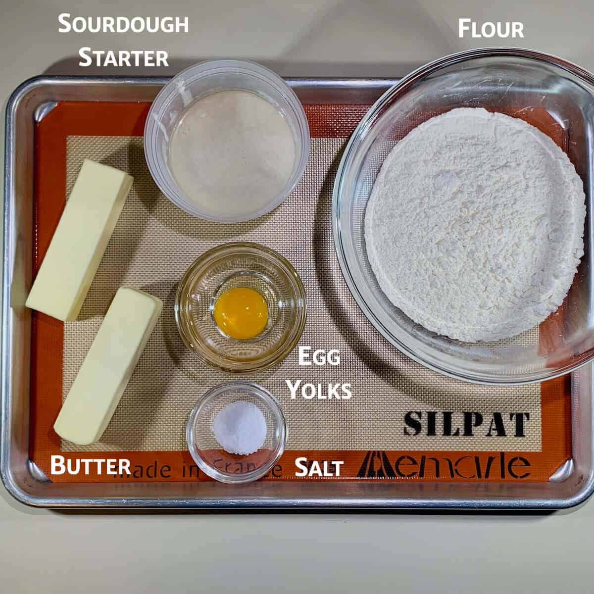 Sourdough Shortcrust Pastry ingredients portioned in glass bowls on a baking tray.