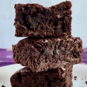 Stack of 3 cake brownies on a white plate Pinterest banner.