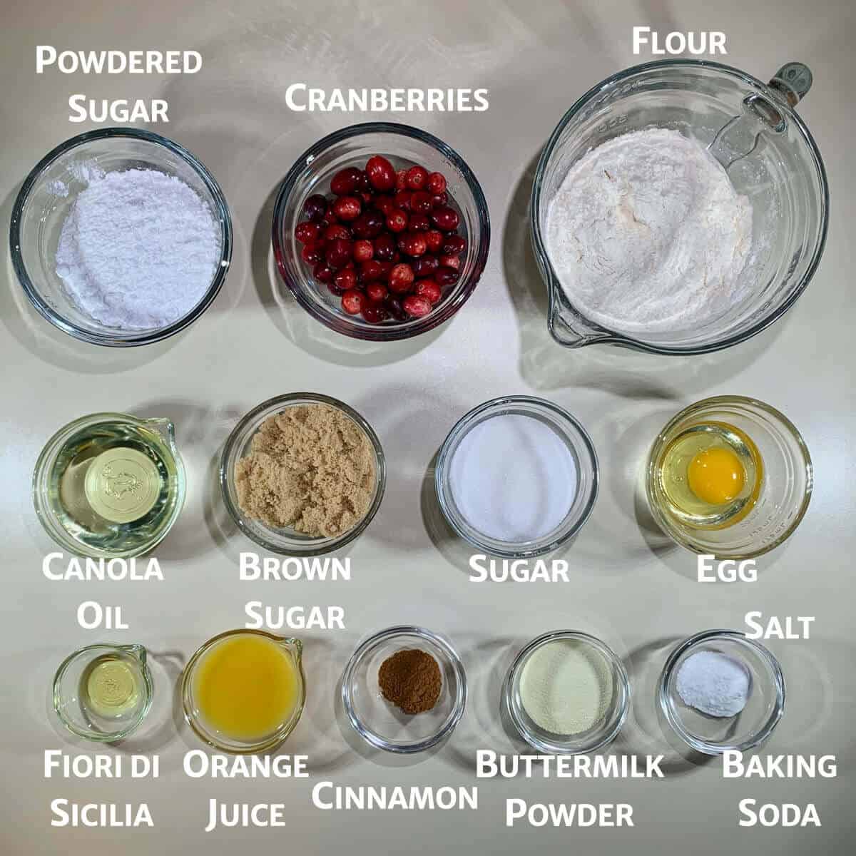Glazed Orange Cranberry Bread ingredients in glass bowls from overhead.