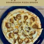 Sliced sourdough pizza on blue plate from overhead Pinterest banner.