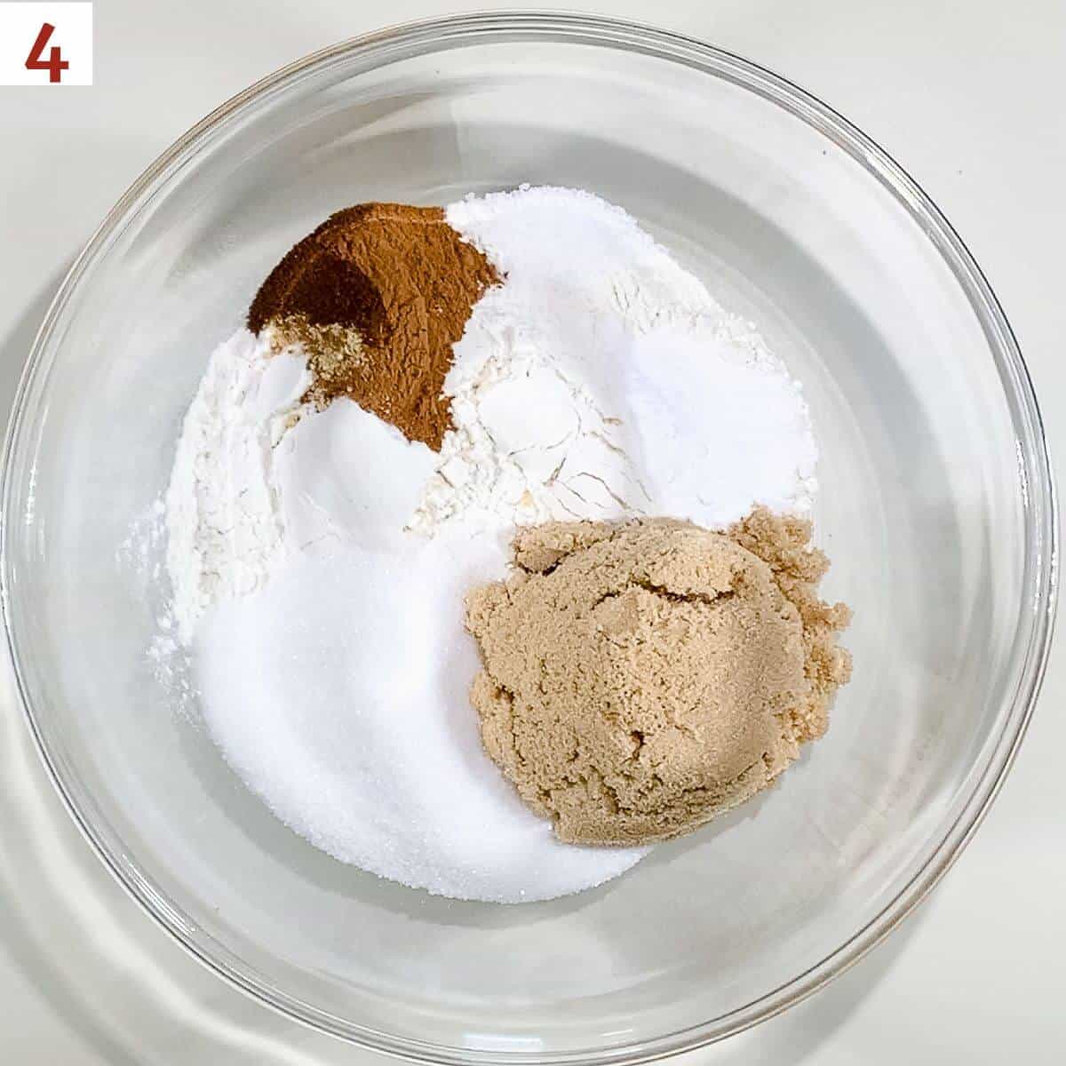 Spice cake dry ingredients in a glass bowl.