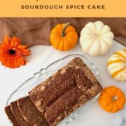 Sourdough Spice Cake sliced on glass plate with pumpkins Pinterest banner.