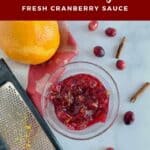 Cranberry Orange Cranberry Sauce in a glass bowl with tools and ingredients from overhead Pinterest banner..Sauce with tools & berries from overhead Pinterest banner