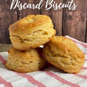 Three biscuits stacked on a red & white striped towel Pinterest banner.