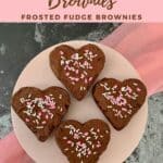 Four heart shaped Fudge Brownies on cake stand from overhead Pinterest banner.