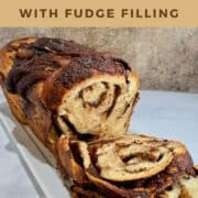 Chocolate Fudge Babka sliced viewed from side Pinterest banner.