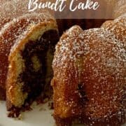 Marble Bundt Cake on cake stand with slice removed.