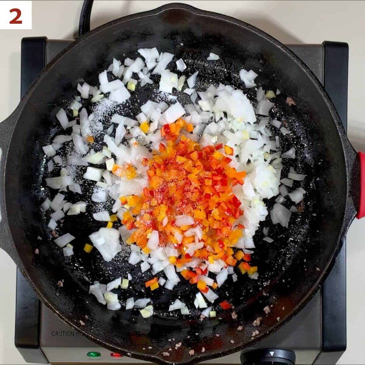 Cooking onions & bell peppers for sloppy joe filling.