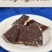 Salted Matzo Toffee broken on a white plate sitting on a blue apron Pinterest banner.