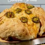 Sourdough Jalapeño Cheddar Bread on cutting board with knife Pinterest banner.