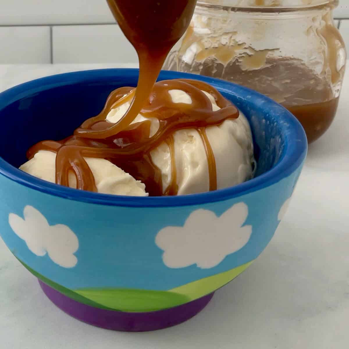 Pouring butterscotch Sauce on vanilla ice cream