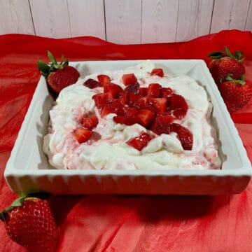 Eton Mess in a bowl on red scarf.