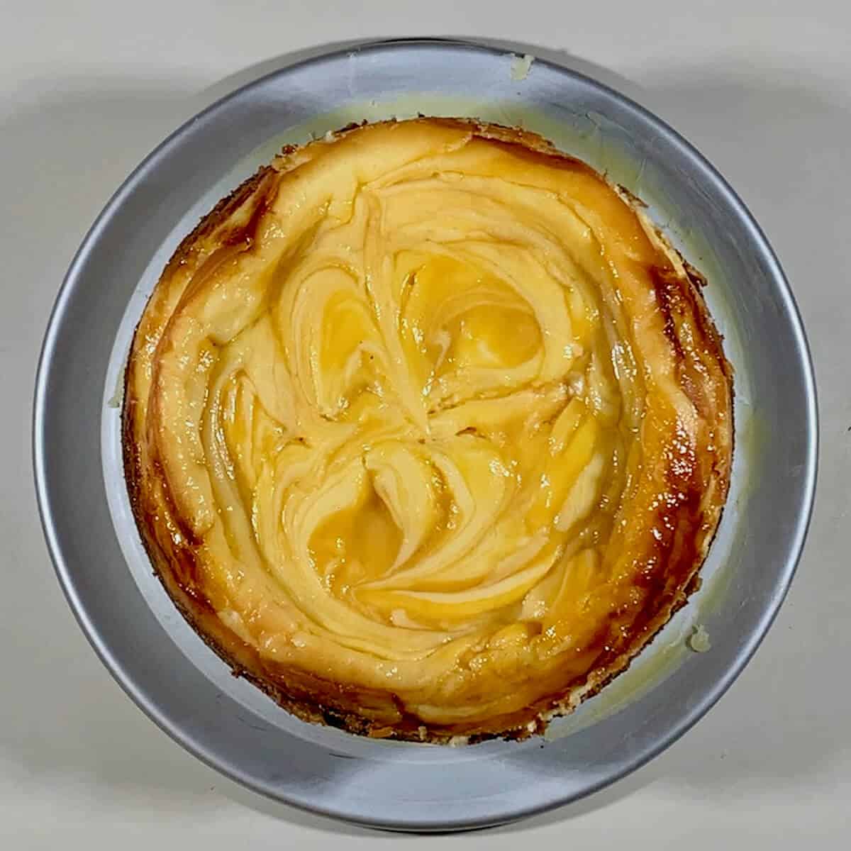 Baked Lemon Curd Marbled Cheesecake viewed from overhead.