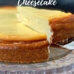 white wine cheesecake on cake plate with slice being lifted out Pinterest banner.