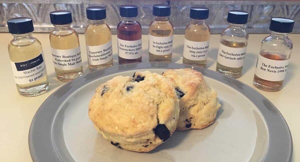 Full lineup of Impex beverages samples in bottles with plated scones.