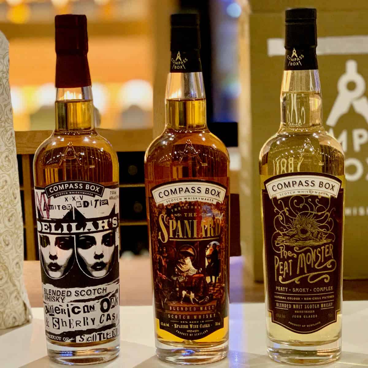 Compass Box Blended Scotch partial lineup in bottles on a counter.