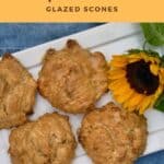 Maple Walnut Scones on a white tray with a sunflower on a blue background from overhead Pinterest banner.