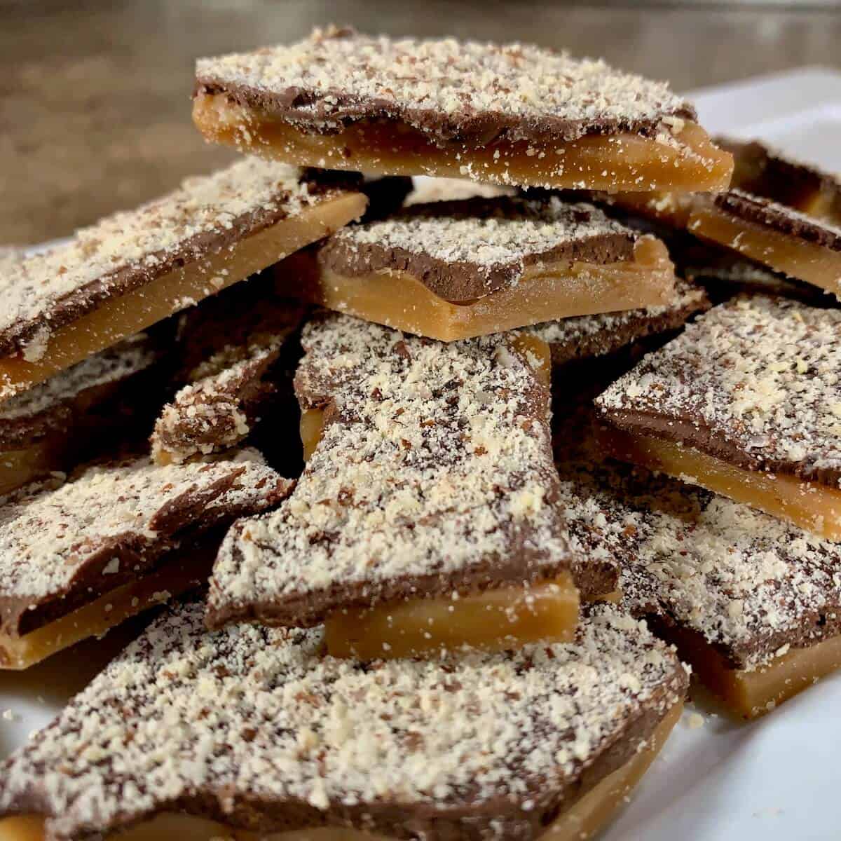 English Toffee stacked on a white plate.