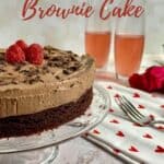 Chocolate Mousse Cake next to a heart-spotted towel with 2 forks, champagne glasses, and roses Pinterest banner.
