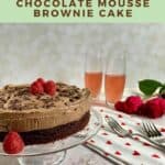 Chocolate Mousse Cake next to a heart-spotted towel with 2 forks, champagne glasses, and roses Pinterest banner.