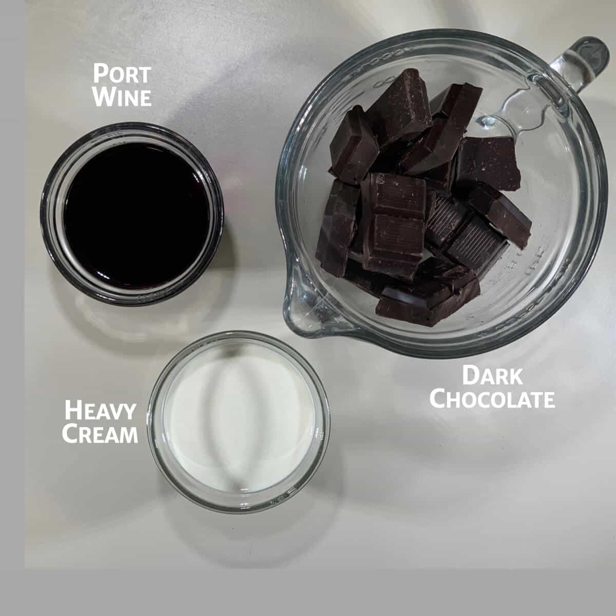 Ingredients for port wine chocolate ganache in glass bowls.