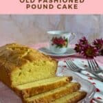 Sliced pound cake on a glass plate with a china coffee cup, forks, a heart spotted towel, and flowers Pinterest banner.