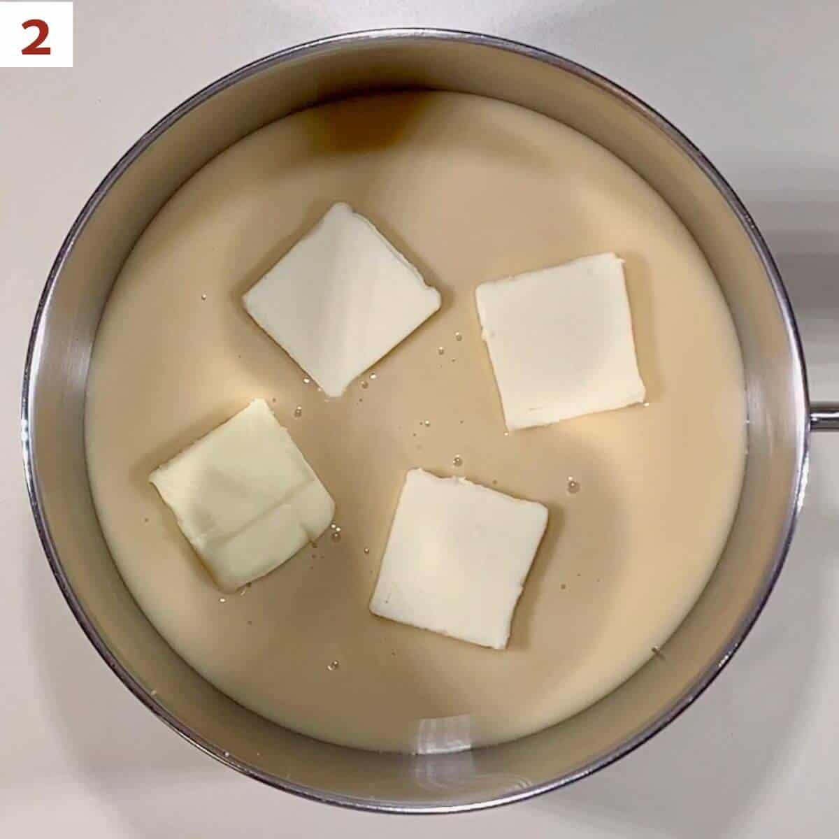 Heating sweetened condensed milk and butter.