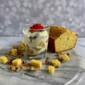 A serving of Orange Cinnamon Trifle with pound cake and strawberries.