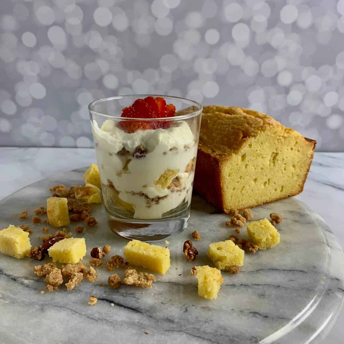 A serving of Orange Cinnamon Trifle with pound cake and strawberries.