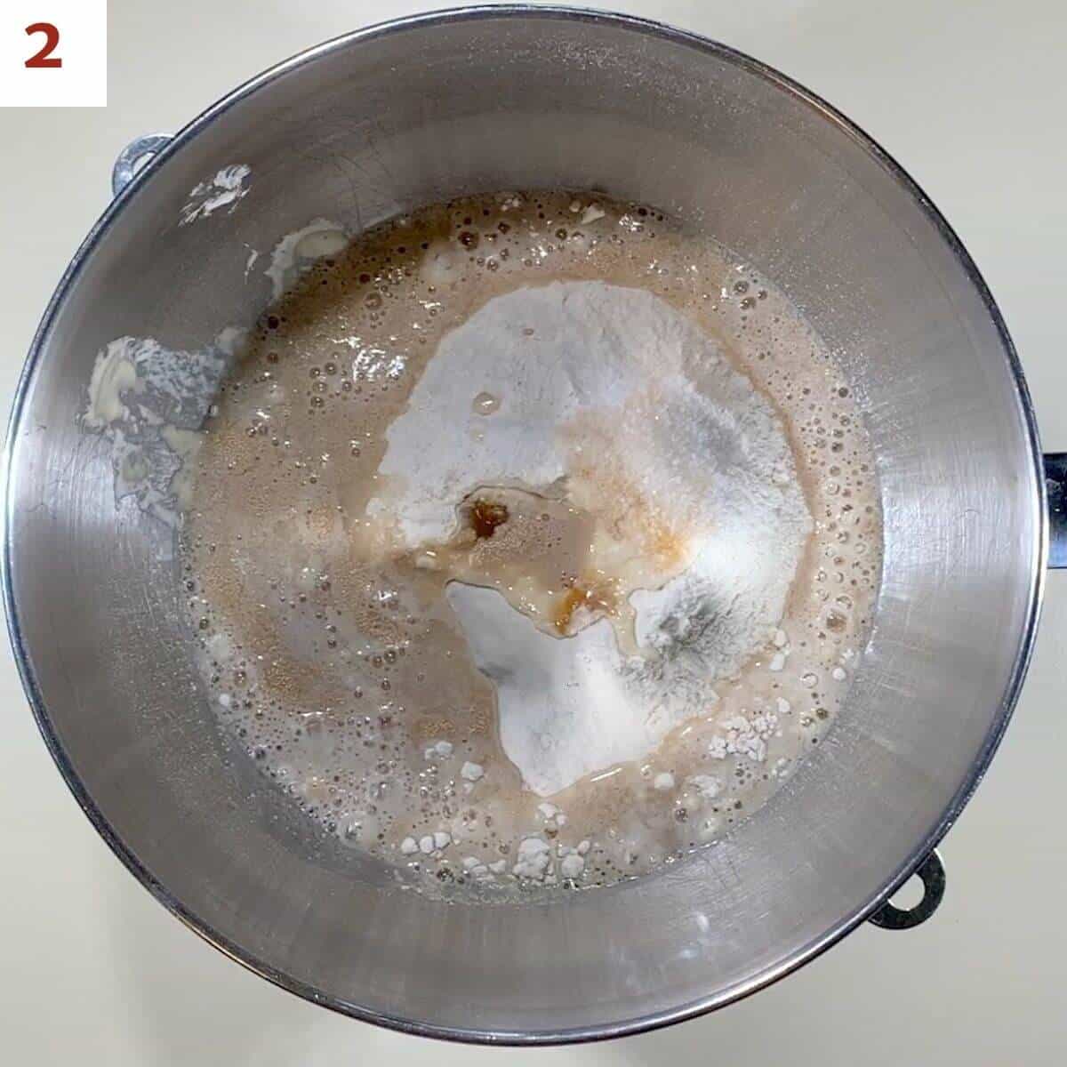 Mixing all bagel dough ingredients in a bowl.