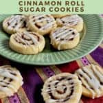 Three cinnamon roll cookies on a striped towel in front of more on a green plate Pinterest banner.