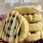 Four Cinnamon roll cookies stacked with one leaning on the stack Pinterest banner.