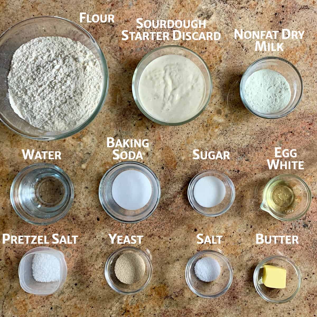 Sourdough pretzels ingredients portioned into glass bowls.