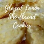 Lemon shortbread stacked on a pink cake stand Pinterest banner.