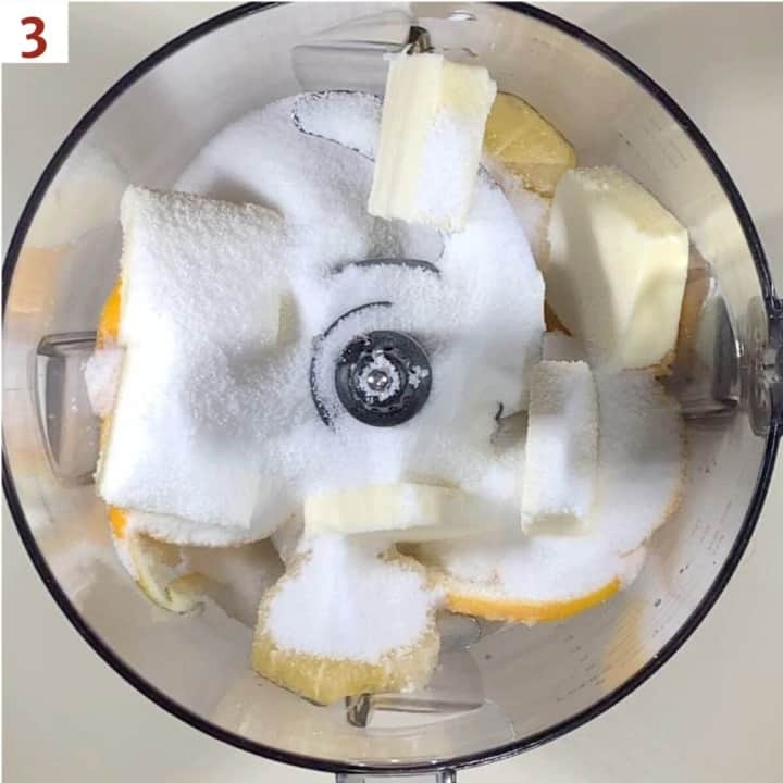 Lemon slices, butter, and sugar in a food processor bowl.