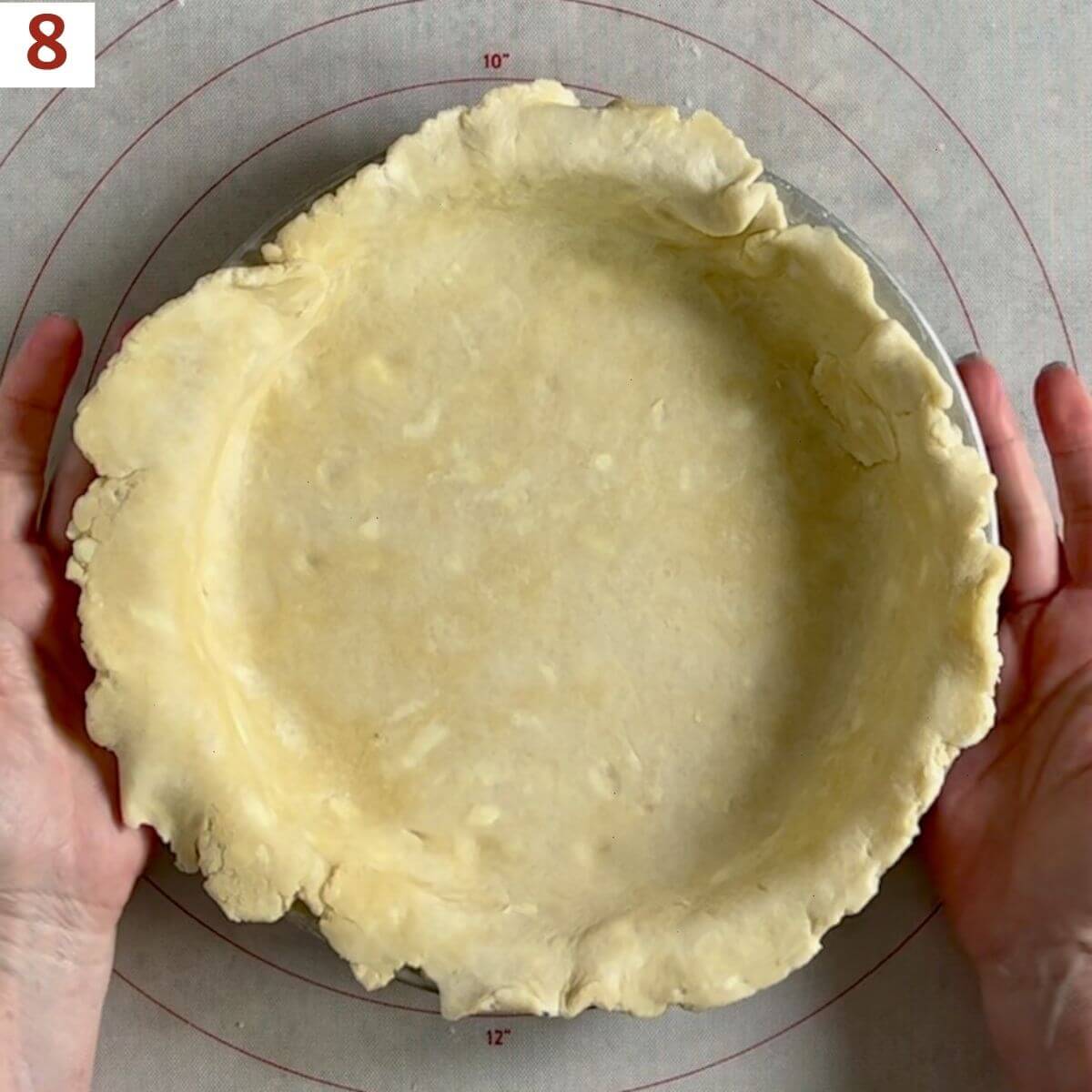 finished pie crust in a pie pan.