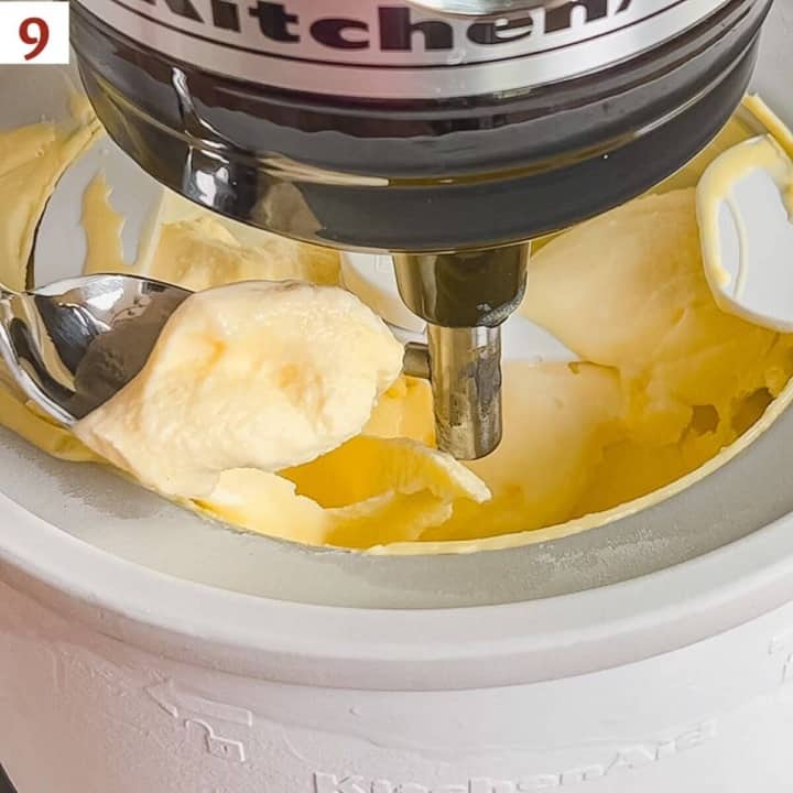 Spoon of gelato lifted from the ice cream maker after churning.