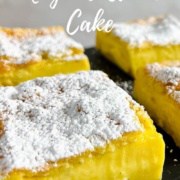 Magic Custard Cake slices on a black slate platter Pinterest banner.