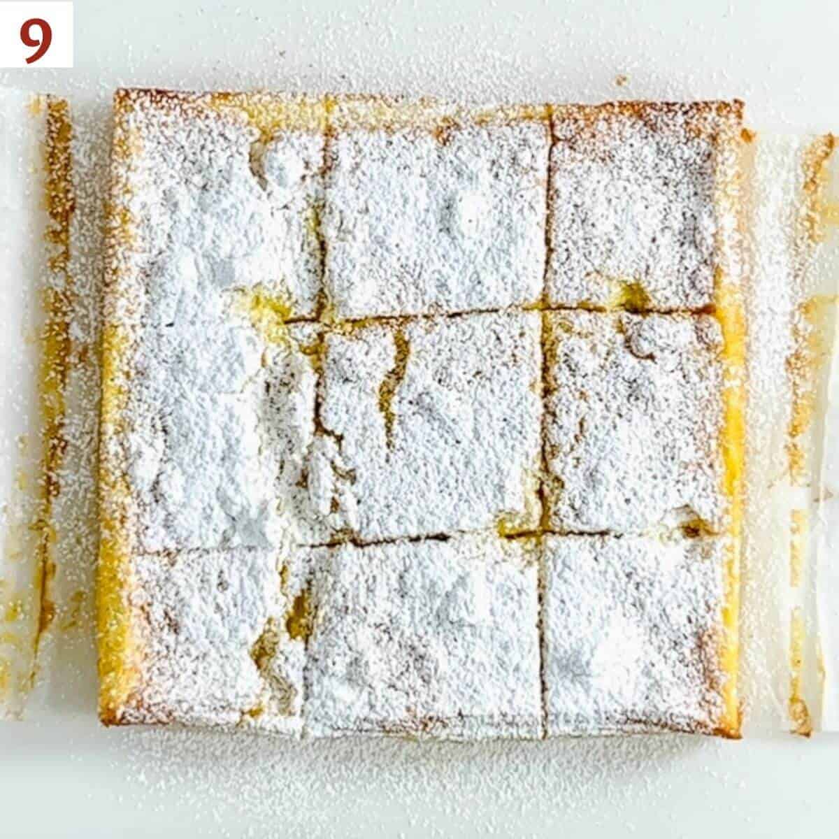 Magic Custard Cake sliced on a cutting board.