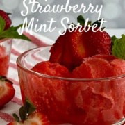 Two bowls of strawberry mint sorbet garnished with strawberries & mint on a red & white striped towel Pinterest banner.
